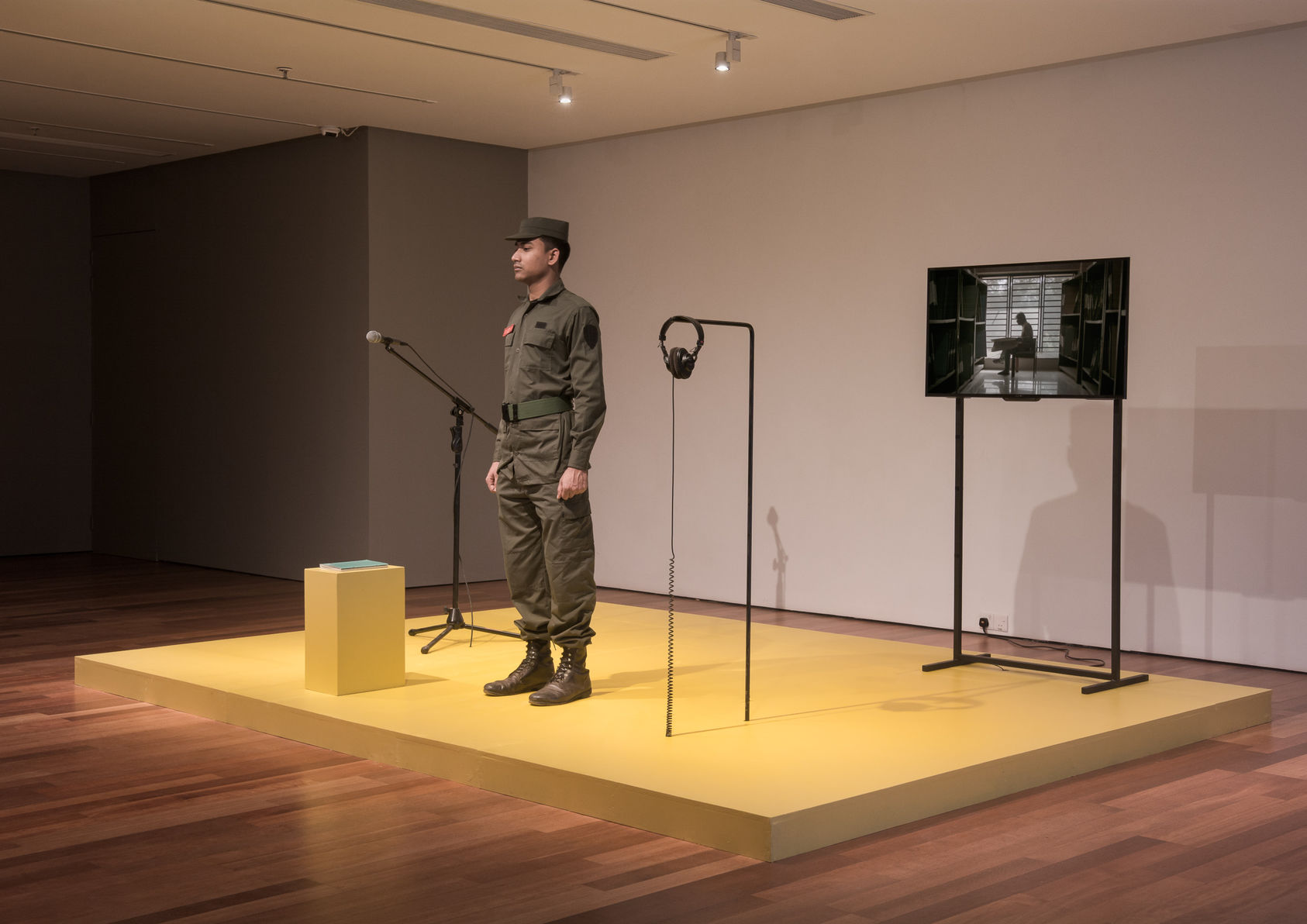 Installation with soldiers, monitors and audio equipment