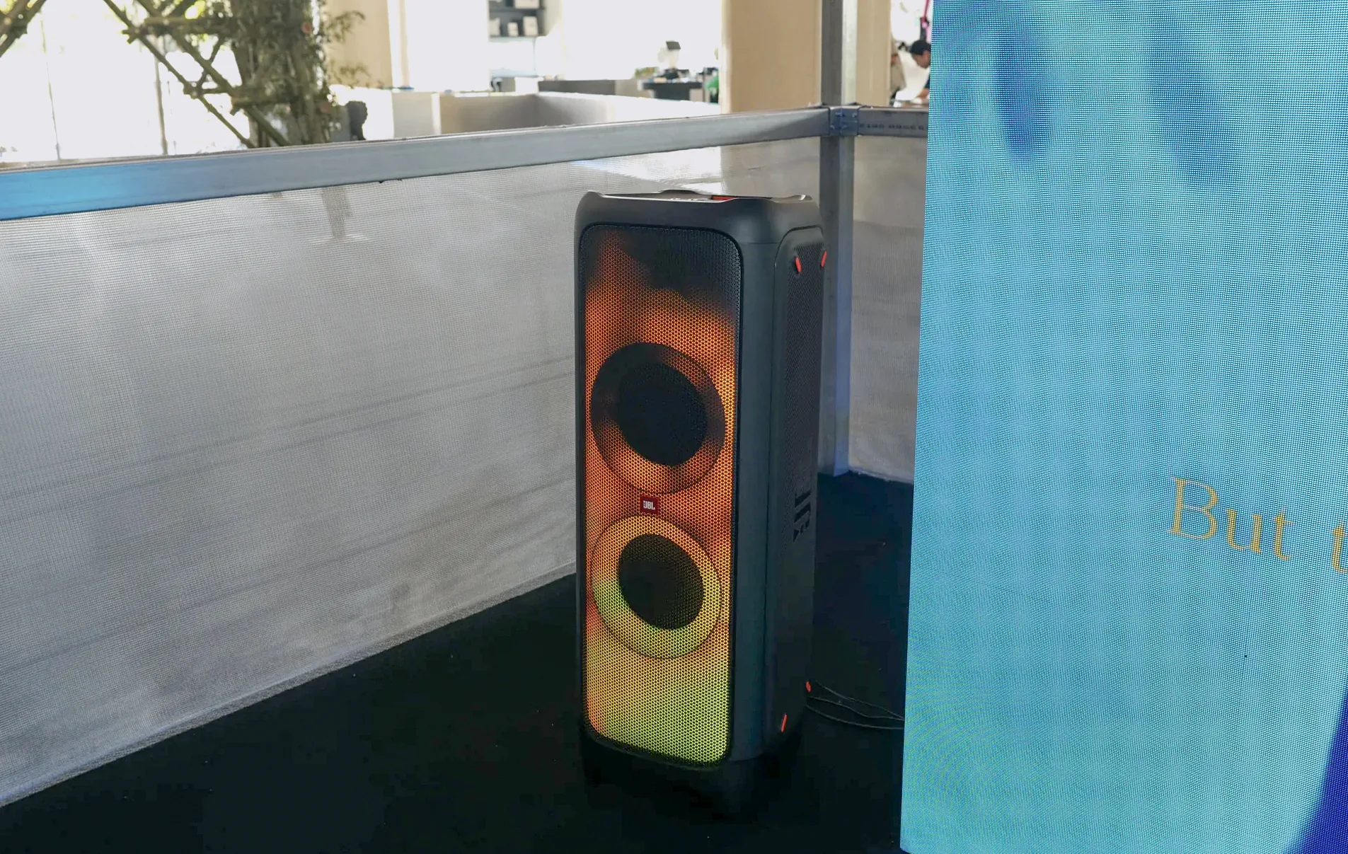 Detail of a JBL PartyBox speaker, silver mesh and LED wall in the BAN♡ITS pavilion