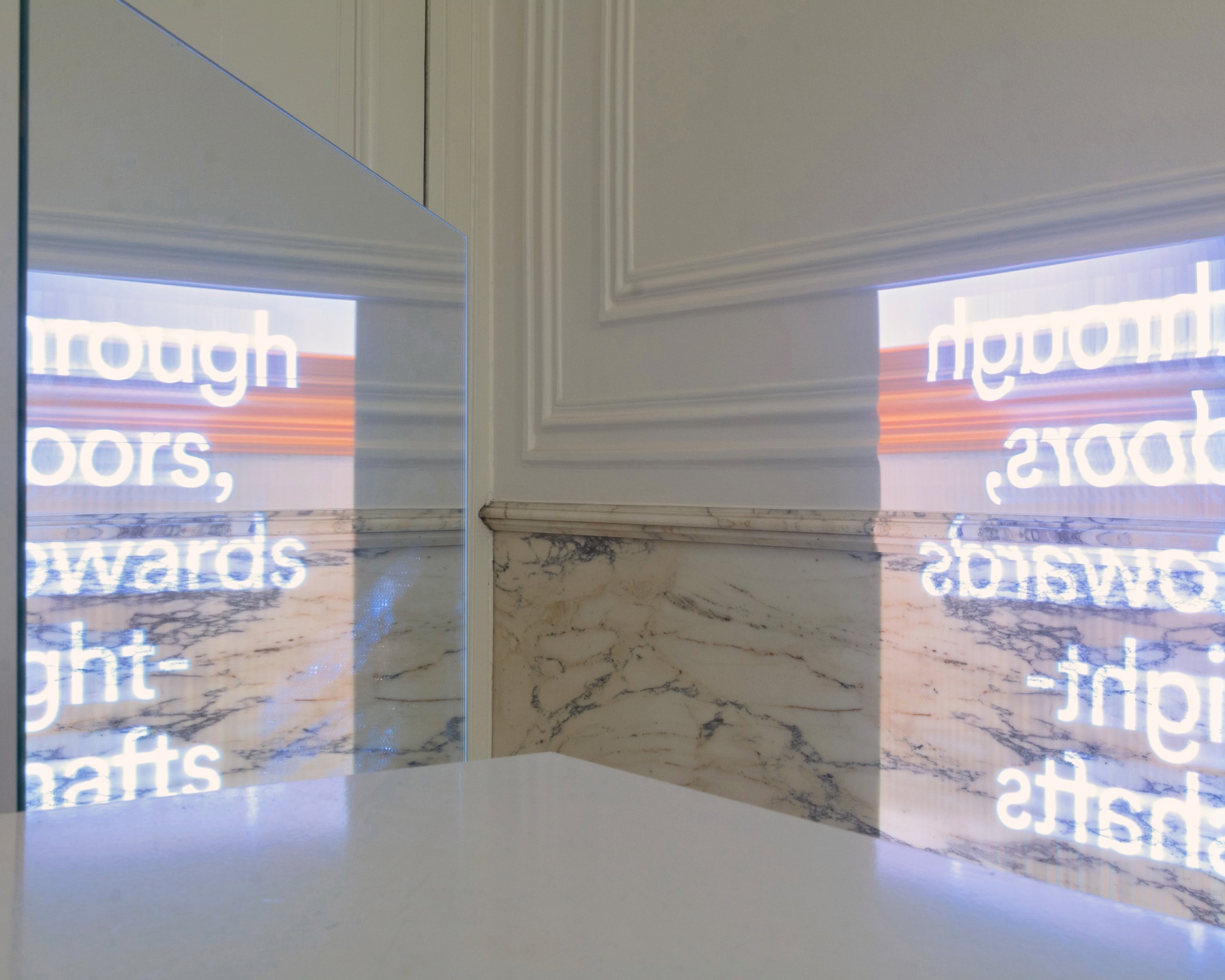 Projected text and imagery refracted through a mirror