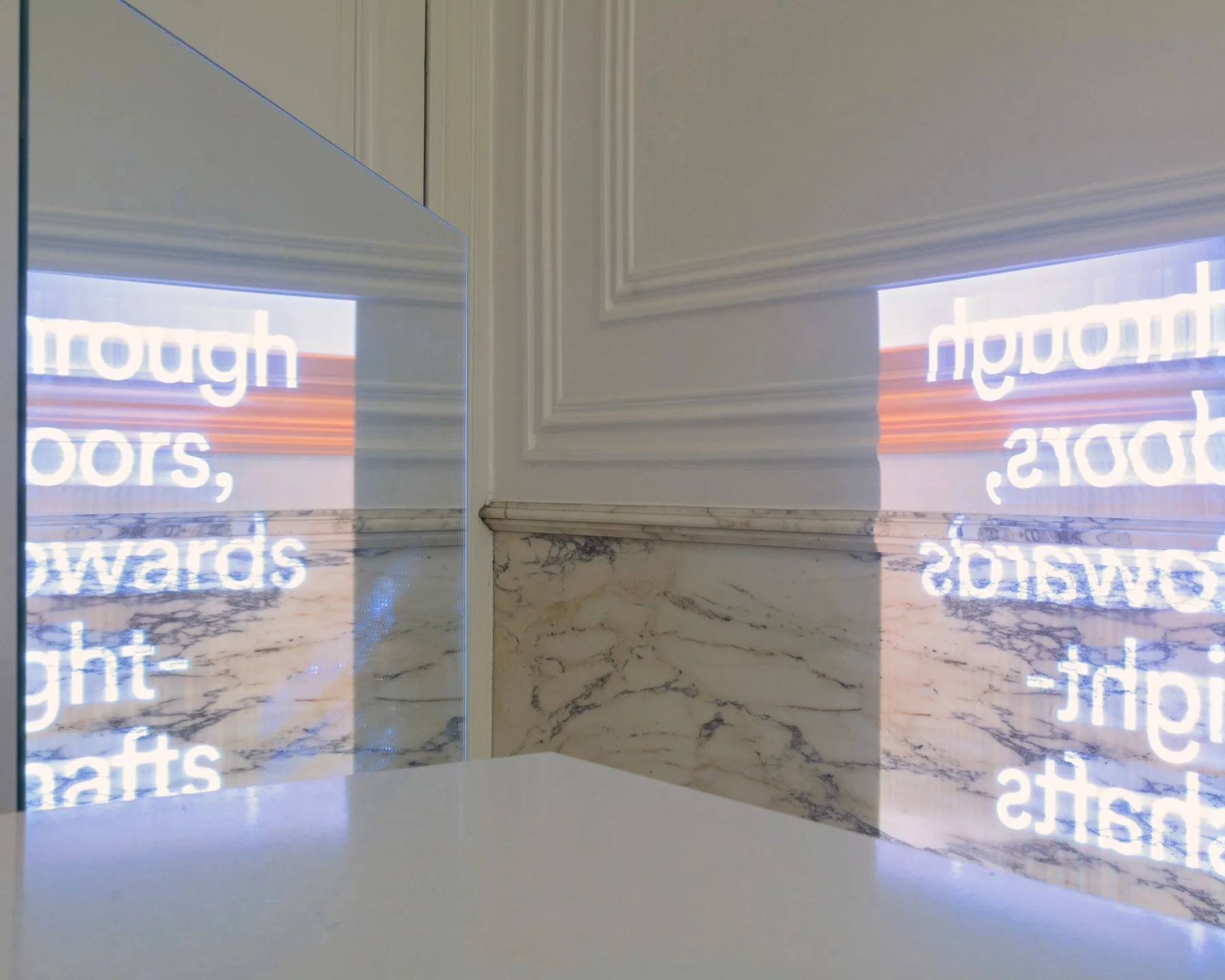 Projected text and imagery refracted through a mirror