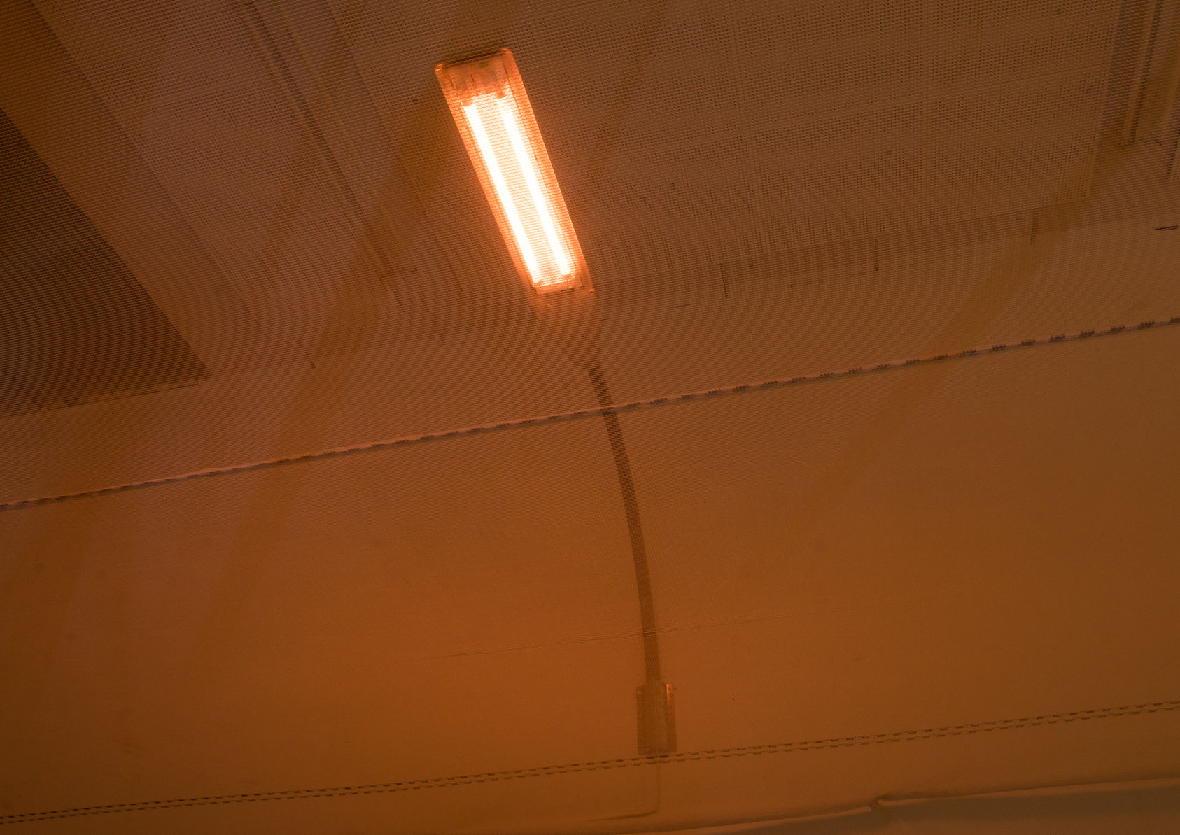 Installation view with netting and synchronised street lights