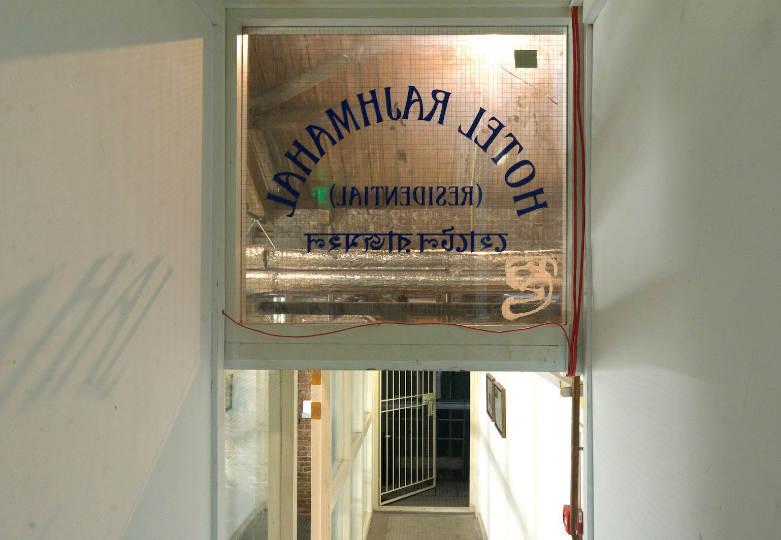 Welded steel front door installed in a corridor