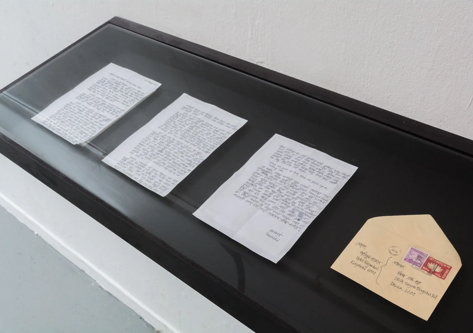 Letters and envelopes displayed in dual vitrines
