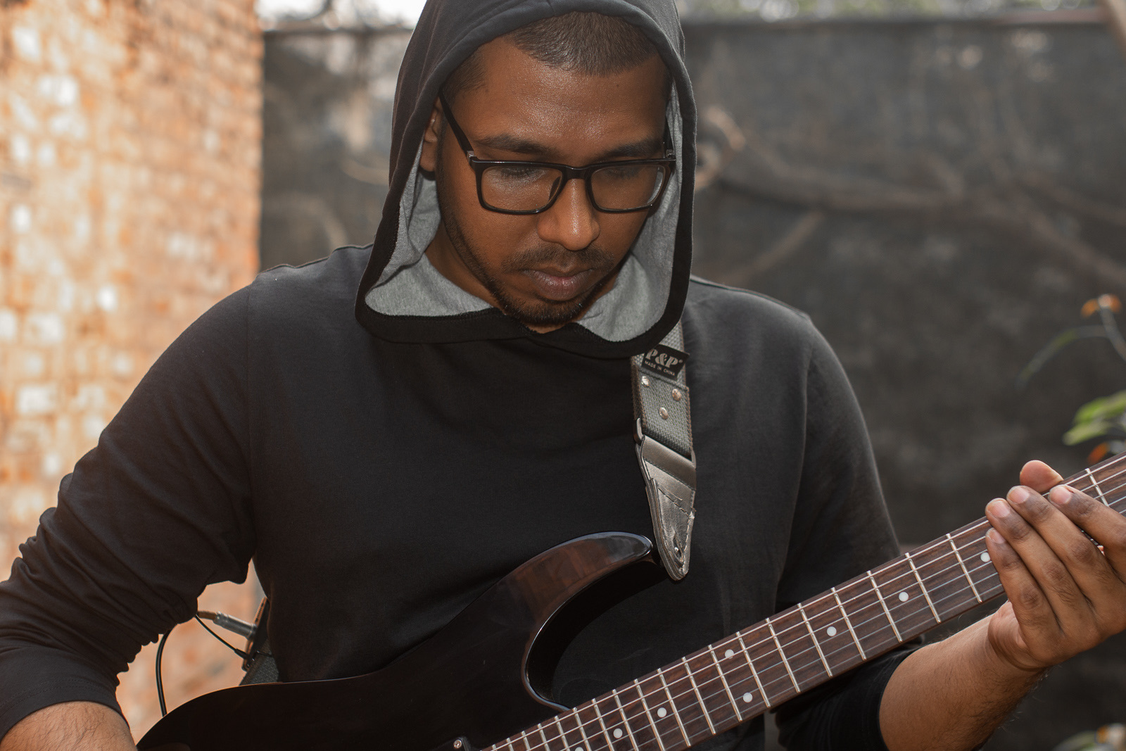 Guitarist performing on the roof during Faydabad For-Sale