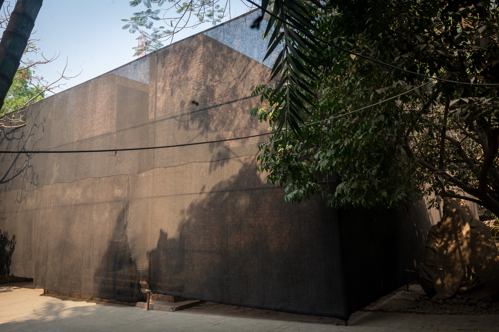 The Faydabad house enclosed in a black hessian shroud