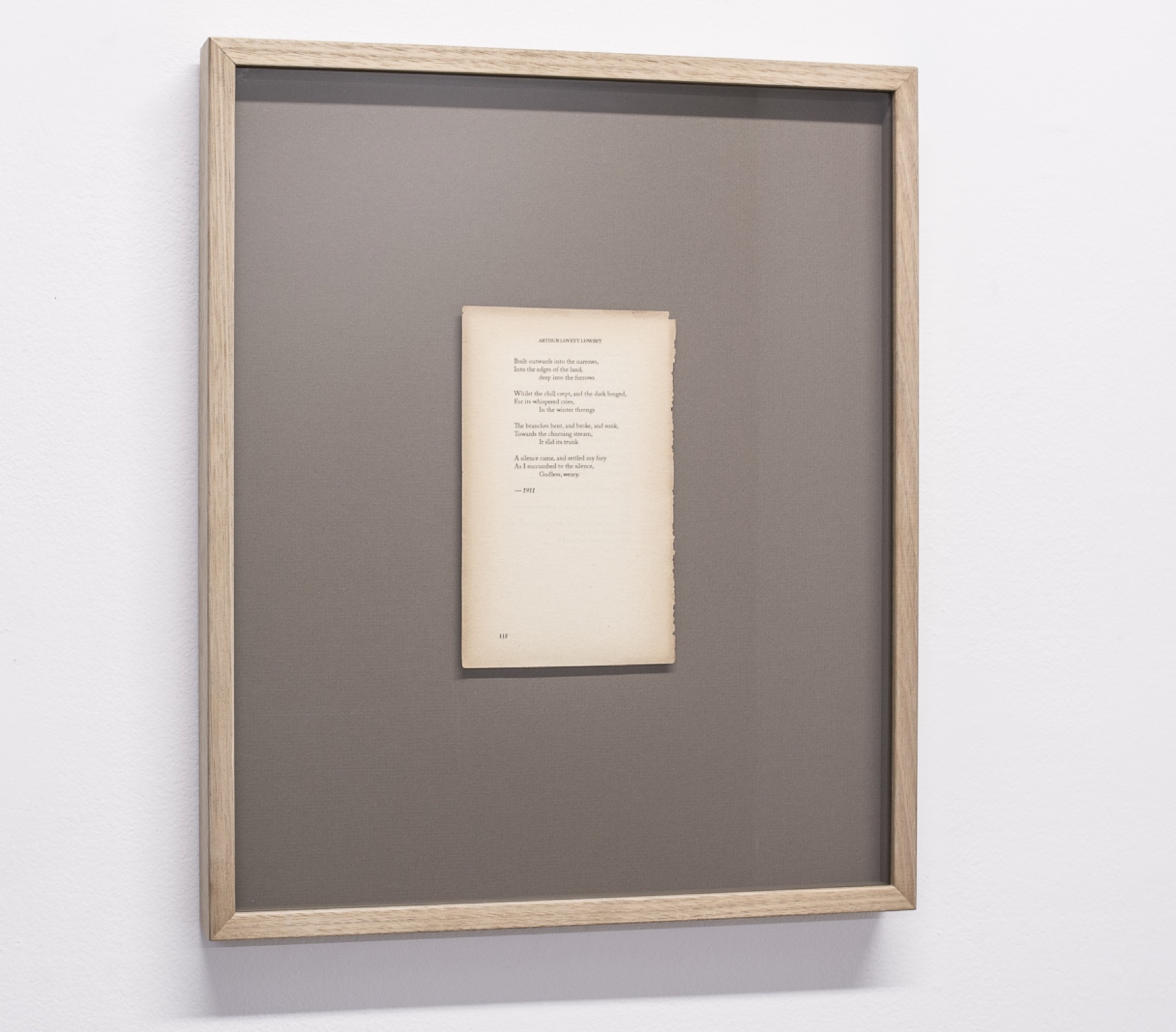 Framed fictional poem on reclaimed paper