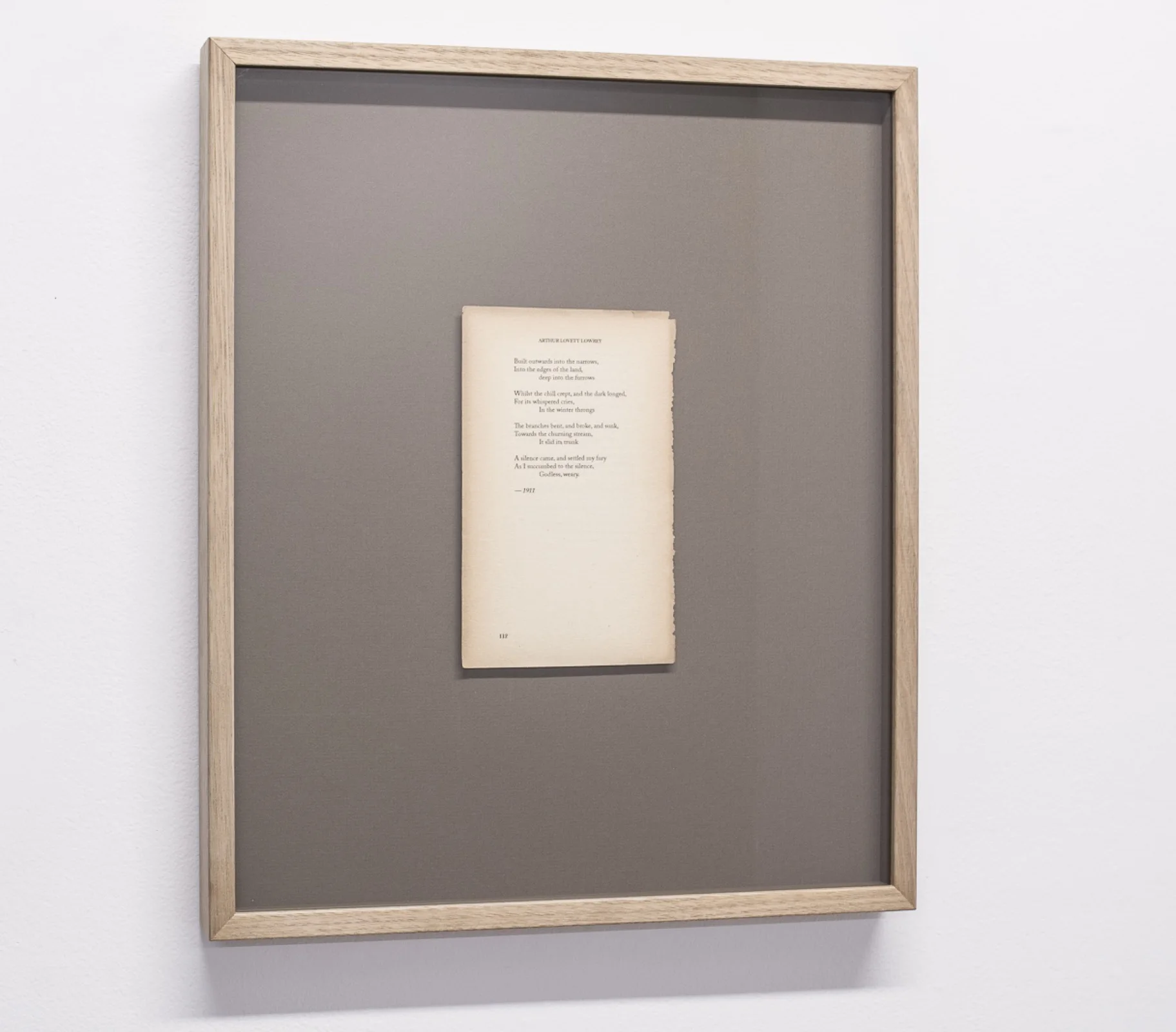 Framed fictional poem on reclaimed paper