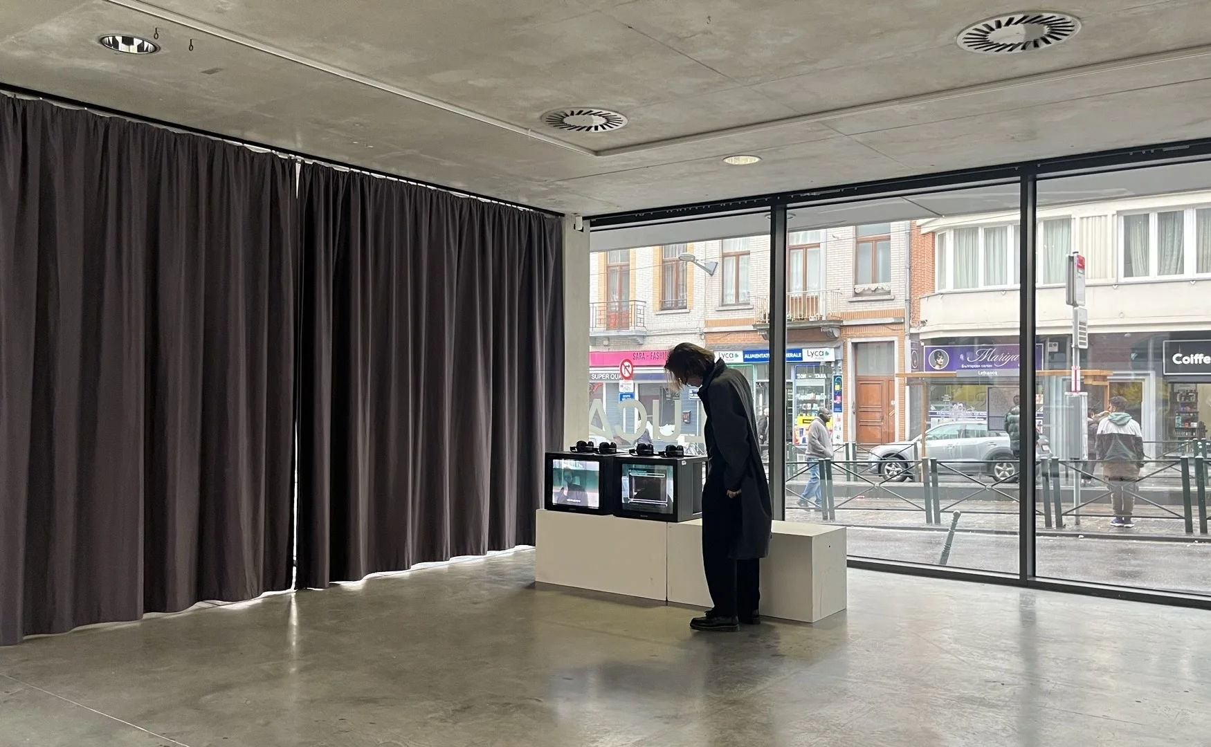 Two monitors showing earlier manifestations of Unsaturn at LUCA School of Arts